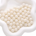 Carved white resin lotus beads for DIY jewelry making displayed on a petal ceramic dish - Lotus (11mm) / 2 Pieces/Pack (Hole Approx. 1.5mm) / White