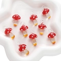 Lot de neuf pendentifs champignons en verre rouge et orange sur un plateau en céramique - 1 Pièce/Paquet (15x26mm) / Rouge Transparent