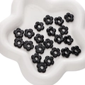 Glossy black flower glass beads for DIY jewelry making displayed in a white tray - 1 Piece/Pack (Diameter 16mm, Hole 4.5mm) / Black