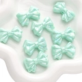 Acht muntgroene iriserende strikkralen van acryl voor DIY-sieraden en knutselen - Gelaagde Strik / Verpakking van 2 (31x21mm) / Groen