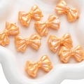 Perline a fiocco in acrilico rosa arancio con finitura AB per creazione gioielli fai da te - Fiocco Stile Impilato / Confezione da 2 (31x21mm) / Rosso Arancio