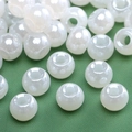 Pearlescent white large hole glass beads for DIY jewelry making on green texture - Pearl White