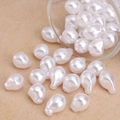 Irregular white Baroque ABS pearls for DIY jewelry making poured from glass container - Mixed Size Artificial Pearl Style (#11)