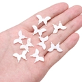 Pearlescent white butterfly shell beads for DIY jewelry making held in a palm - 1 Piece (13x20mm)