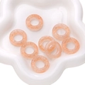 Orange swirl glass charm beads for DIY jewelry making displayed on a white plate - 5 Pieces/Pack (25x13.5x5.5mm) / Pale Green