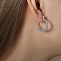 Baroque style twisted silver hoop earrings in stainless steel on female model - F1214-Twisted Rope / Steel