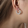 Baroque retro silver hoop earrings with embossed texture for women on a model - F1215-Vintage Engraved / Steel