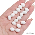 White 8x11mm faceted oval ceramic-style beads held in hand for DIY jewelry making - Faceted Olive Bead / 5 Pcs/Pack / White