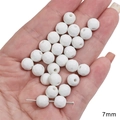 7mm faceted white ceramic beads for DIY jewelry making shown on hand for scale - Faceted Sphere / 7mm (5 Pieces/Pack) / White