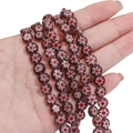 Purple millefiori glass beads for DIY jewelry making with red floral pattern in a flat round shape - Purple