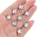 Silver-toned heart planet charms with iridescent stones held in hand for DIY jewelry - Ring Star Heart Pendant / 1 Piece