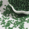 Deep green silver-lined glass seed beads in a white bowl for DIY bracelet making - Dark Green