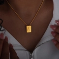 Hip hop style gold square pendant necklace featuring embossed letter A on a thin chain - Letter A Style (P1506-A)