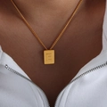 Gold letter E rectangular pendant necklace in titanium steel on woman's neck - Letter E Style (P1506-E)