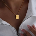 Golden titanium steel rectangular pendant necklace featuring an engraved letter T - Letter T Style (P1506-T)