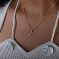 Golden Sagittarius constellation pendant necklace with white zircons on model neck - Sagittarius Style (P1527)