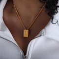 Gold plated stainless steel square pendant necklace featuring embossed letter U on curb chain - Letter U Style (P1506-U)