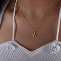 Vintage gold plated titanium steel zodiac necklace with sparkling crystal inlay on model - Pisces Style (P1527)
