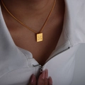 Gold-plated rectangle pendant necklace featuring an embossed letter X on a curb chain - Letter X Style (P1506-X)