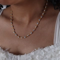 Golden 18k necklace with blue and white evil eye beads on fashion model neck - White Blue Style (P1528)