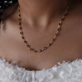 Gold plated evil eye bracelet with blue and white beads on a female model neck - Black Style (P1528)