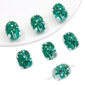 Detail of green glass beads with embossed Christmas tree patterns for DIY jewelry - Snowflake Christmas Tree