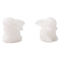 Detailed macro view of two translucent white resin bunny charms for DIY jewelry making - White