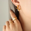 Golden star earrings and pearl ring set on model with a minimalist aesthetic style - Pentagram Style (F338) / Gold