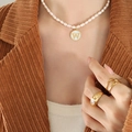 Freshwater pearl necklace with gold letter W pendant and matching gold rings on model - Letter W