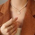Freshwater pearl necklace featuring a gold letter F shell pendant and gold zircon ring - Letter F