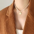Baroque freshwater pearl necklace featuring a gold-framed white shell letter I pendant - Letter I