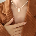 Freshwater pearl necklace with gold letter J pendant and bow ring on model - Letter J