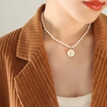 Baroque natural pearl necklace featuring a golden pendant with the letter P detail - Letter P