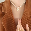 Freshwater pearl necklace with gold letter L pendant on white shell base for women - Letter L