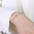 Pulsera geométrica ondulada de acero inoxidable plateado pulido para mujer - Plateado