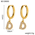 Macro detail of gold-plated letter D earrings with size markings and weight metrics - D Style (d)