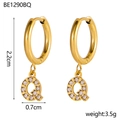Detailed view of gold letter Q hoop earrings with zircon pavé and 2.2cm height dimension - Q Style (q)