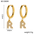 Detailed macro view of 18K gold plated hoop earring with letter R zircon pendant - R Style (r)