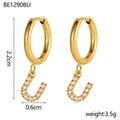 Detailed macro view of 18K gold plated hoop earrings with U-shaped zircon letter charms - U Style (u)