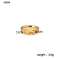 Macro shot of gold stainless steel ring with rainbow zircon inlay and dot texture details - US 7 / Gold