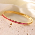 18K vergoldeter Edelstahl-Armreif mit rosa quadratisch geschliffenen Steinen - Zahl 4 / Gold + Rosafarbener Stein