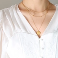 Three-layer gold pendant necklace featuring Good Luck circular coin on a layered chain - Gold 3-Layer Necklace / Gold