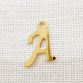 Macro shot of polished gold letter A pendant made of durable stainless steel for DIY jewelry - Letter A