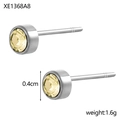 Orecchini tondi in finitura argento con zircone giallo chiaro da 0,4 cm incastonato - Acciaio Giallo