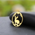 Golden stainless steel rabbit pendant with floral wreath on a black stone background - Gold (Rabbit 1)