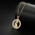 Macro shot of gold-plated pendant with sparkling crystals and pregnant woman silhouette - Gold - Pregnant Mom