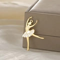 Golden ballet dancer pendant with white enamel dress on a soft fabric background - Gold-Ballet Dancer Style 2