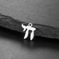 Macro shot of silver Chai symbol pendant representing life on a black stone surface - Single Hole / Steel