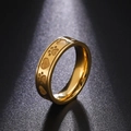 Macro detail of golden stainless steel ring featuring engraved heart and paw print patterns - US 7 / Gold