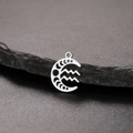Detailed view of silver stainless steel moon phase and Aquarius zodiac pendant for DIY jewelry - Silver-Aquarius